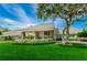 Exterior of clubhouse with manicured lawn, stone accents and an inviting entrance at 7065 Sparkling Creek Ct, Spring Hill, FL 34606
