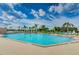 Large community pool offers plenty of space for swimming and lounging under the sun at 7065 Sparkling Creek Ct, Spring Hill, FL 34606