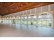 Spacious community room with large windows and wood floors at 7065 Sparkling Creek Ct, Spring Hill, FL 34606