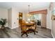 Comfortable dining area featuring a sliding door, natural light and hardwood floors at 7065 Sparkling Creek Ct, Spring Hill, FL 34606