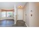 Bright entryway with vinyl flooring and built-in shelving at 7065 Sparkling Creek Ct, Spring Hill, FL 34606