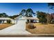 Inviting single-Gathering home with a well-manicured front lawn and attached garage at 7065 Sparkling Creek Ct, Spring Hill, FL 34606
