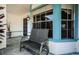 Inviting front porch with a bench and decorative plants at 7065 Sparkling Creek Ct, Spring Hill, FL 34606