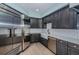 Modern kitchen with stainless steel appliances and white cabinets at 7065 Sparkling Creek Ct, Spring Hill, FL 34606