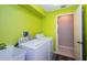 Bright laundry room featuring a utility sink and new appliances at 7065 Sparkling Creek Ct, Spring Hill, FL 34606