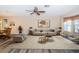 Open living room with lots of natural light, a ceiling fan and neutral decor at 7065 Sparkling Creek Ct, Spring Hill, FL 34606