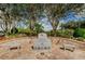 Veterans memorial with benches and brick landscaping at 7065 Sparkling Creek Ct, Spring Hill, FL 34606