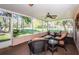 This screened patio features great outdoor views and comfortable seating at 7065 Sparkling Creek Ct, Spring Hill, FL 34606