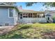Large backyard with grass, patio, and sunshade at 764 Captiva Ne Ct, St Petersburg, FL 33702