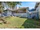 Expansive backyard with a spacious deck and lush lawn at 764 Captiva Ne Ct, St Petersburg, FL 33702