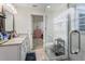 Modern bathroom with granite vanity and walk-in shower at 764 Captiva Ne Ct, St Petersburg, FL 33702