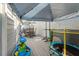 Deck with patio furniture, trampoline, and play area at 764 Captiva Ne Ct, St Petersburg, FL 33702