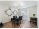 Dining area with glass table, black chairs, and access to patio at 764 Captiva Ne Ct, St Petersburg, FL 33702