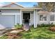 Front entrance with a covered porch and festive decor at 764 Captiva Ne Ct, St Petersburg, FL 33702