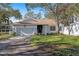 Cute light blue house with a nicely landscaped lawn and driveway at 764 Captiva Ne Ct, St Petersburg, FL 33702