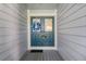 Double blue front doors with a seasonal wreath at 764 Captiva Ne Ct, St Petersburg, FL 33702