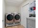Laundry room with washer, dryer, and ample storage at 764 Captiva Ne Ct, St Petersburg, FL 33702