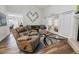 Relaxing living room with a cozy recliner and hardwood floors at 764 Captiva Ne Ct, St Petersburg, FL 33702