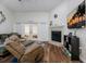 Gathering room with fireplace, hardwood floors and lots of natural light at 764 Captiva Ne Ct, St Petersburg, FL 33702