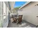 Outdoor patio with table and chairs for dining and relaxing at 764 Captiva Ne Ct, St Petersburg, FL 33702