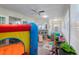 Playroom with inflatable playhouse and colorful playmat at 764 Captiva Ne Ct, St Petersburg, FL 33702