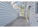 Covered screened porch with light wood flooring and white walls at 764 Captiva Ne Ct, St Petersburg, FL 33702