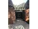 Brick walkway leading to black double doors under pergola at 807 Grove Park Ave, Tampa, FL 33609