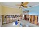 A living room undergoing renovation, featuring exposed walls and flooring at 8114 Causeway S Blvd, St Petersburg, FL 33707