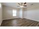 Spacious bedroom with wood-look flooring and a ceiling fan at 849 Haleybury St, Port Charlotte, FL 33948