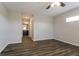 Bright bedroom with wood-look flooring and ceiling fan at 849 Haleybury St, Port Charlotte, FL 33948