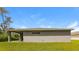 Single-story home with covered patio and grassy yard at 849 Haleybury St, Port Charlotte, FL 33948