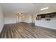 Spacious living room with wood-look flooring and an open layout at 849 Haleybury St, Port Charlotte, FL 33948