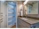 Bathroom with modern vanity and a sleek, frameless mirror at 8565 W Gulf Blvd # 17S, Treasure Island, FL 33706