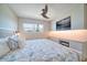 Bright bedroom with a king-size bed and built-in entertainment center at 8565 W Gulf Blvd # 17S, Treasure Island, FL 33706