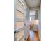 Bright hallway with modern doors and light wood flooring at 8565 W Gulf Blvd # 17S, Treasure Island, FL 33706