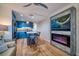 Living room with a modern fireplace and kitchen at 8565 W Gulf Blvd # 17S, Treasure Island, FL 33706