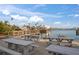 Picnic tables overlook a calm waterway with boats at 8565 W Gulf Blvd # 17S, Treasure Island, FL 33706