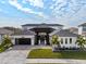 Stunning two-story home with modern design and a three-car garage at 8621 Ivy Stark Blvd, Wesley Chapel, FL 33545