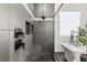 Elegant bathroom with a walk-in shower and pebble floor at 8621 Ivy Stark Blvd, Wesley Chapel, FL 33545