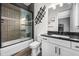 Clean bathroom with a shower/tub combo and white vanity at 8621 Ivy Stark Blvd, Wesley Chapel, FL 33545