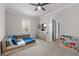 bedroom with wood platform bed and blue bedding at 8621 Ivy Stark Blvd, Wesley Chapel, FL 33545