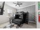 bedroom with built-in bunk bed and grey walls at 8621 Ivy Stark Blvd, Wesley Chapel, FL 33545