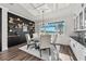 Bright dining room with a round table, water views, and modern chandelier at 8621 Ivy Stark Blvd, Wesley Chapel, FL 33545