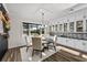 Bright dining room with a round table and water views at 8621 Ivy Stark Blvd, Wesley Chapel, FL 33545
