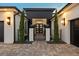 Modern entryway with black and white finishes, and a metal gate at 8621 Ivy Stark Blvd, Wesley Chapel, FL 33545