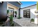 Modern home exterior with double front doors and landscaped walkway at 8621 Ivy Stark Blvd, Wesley Chapel, FL 33545