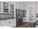 Modern kitchen with stainless steel appliances and white cabinets at 8621 Ivy Stark Blvd, Wesley Chapel, FL 33545