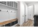 Laundry room with built-in storage and a bench at 8621 Ivy Stark Blvd, Wesley Chapel, FL 33545