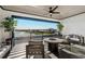 Outdoor patio with fire pit and seating overlooking a lake at 8621 Ivy Stark Blvd, Wesley Chapel, FL 33545