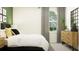 Bright bedroom with a comfortable bed and stylish dresser at 9404 Runaway Breeze Dr, Land O Lakes, FL 34637